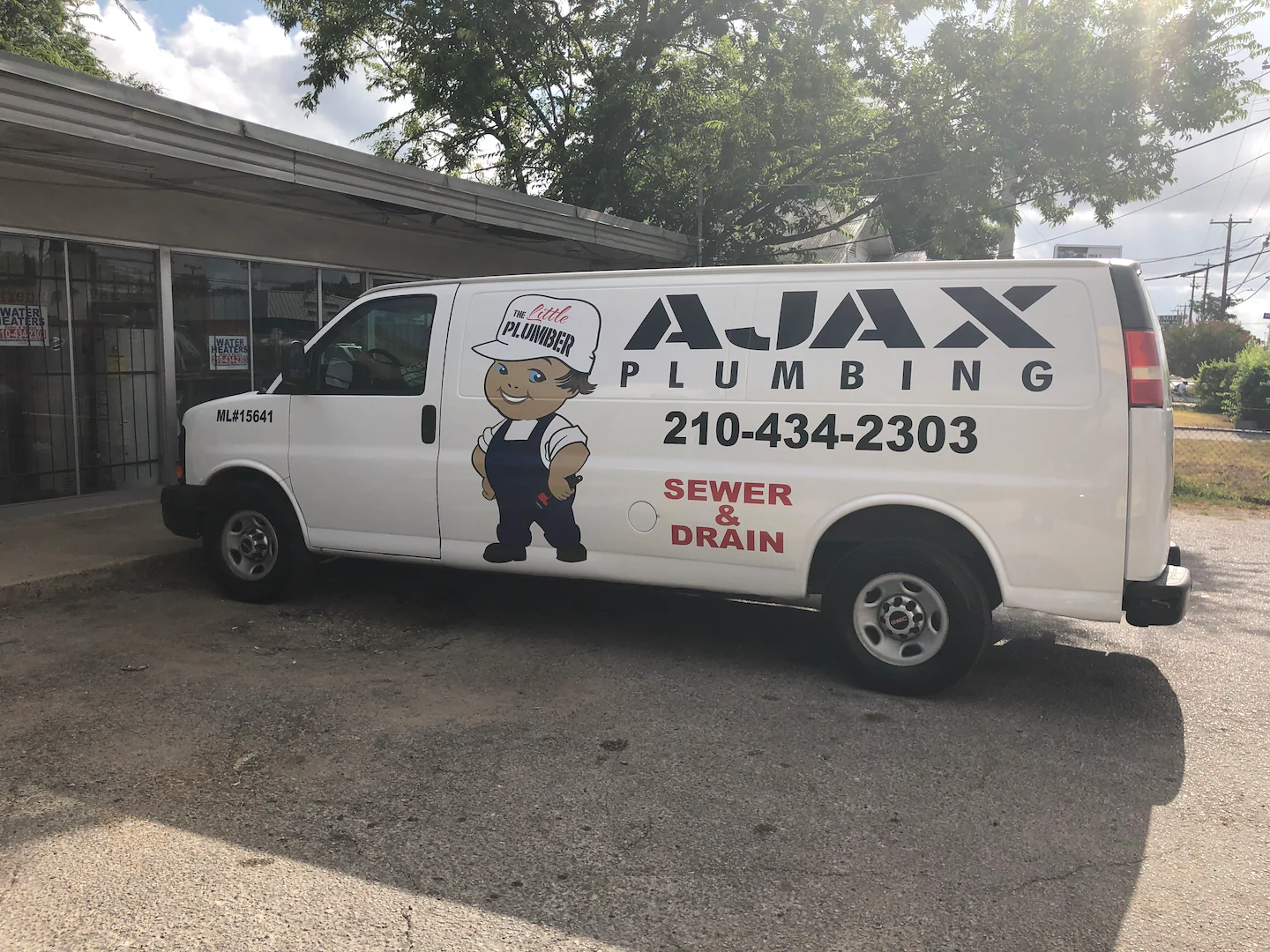 Ajax Plumbing van at the shop on W Commerce St, San Antonio
